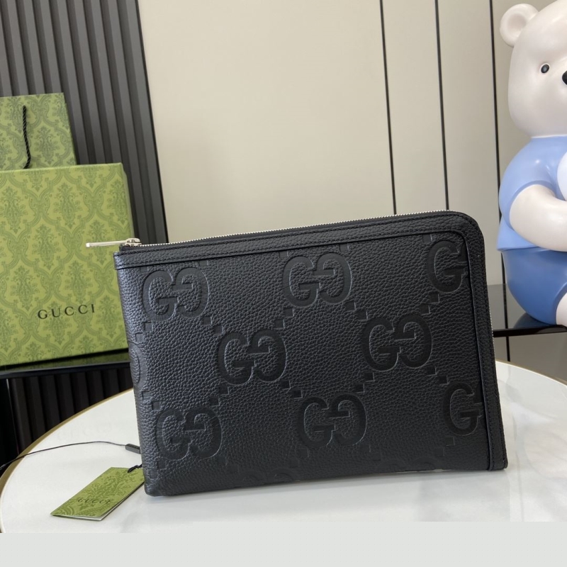 G*u*i clutch bags